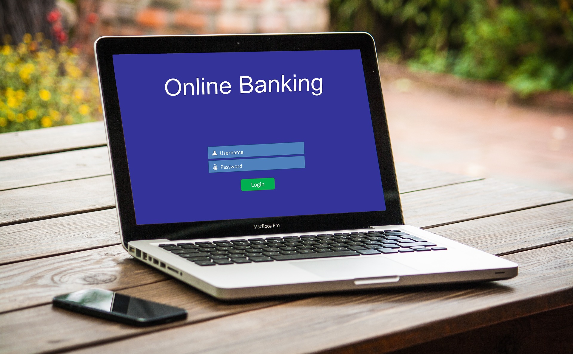 A laptop computer displaying a login screen for online banking